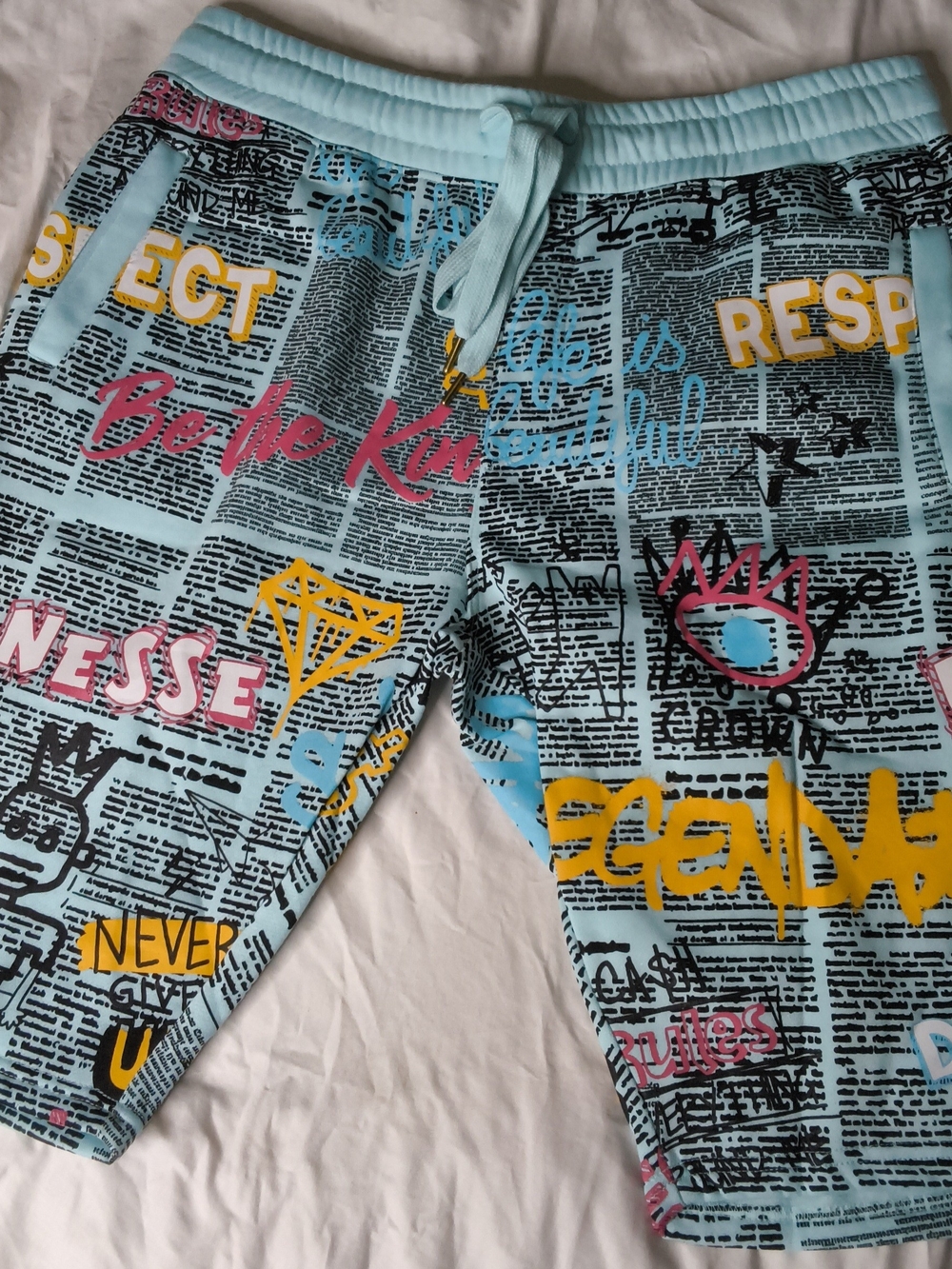 Men's Light Blue Graphic Jogger Shorts with Multicolor Print